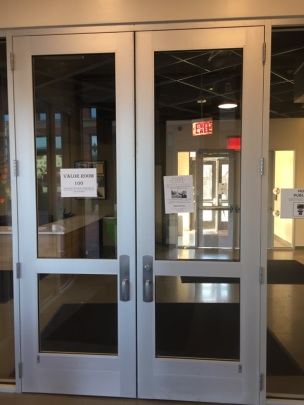 These are the are the tall entrance doors which have glass panels throughout the middle.