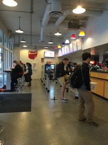 This image shows the counter where the food is order and the surrounding space including high counter seating.